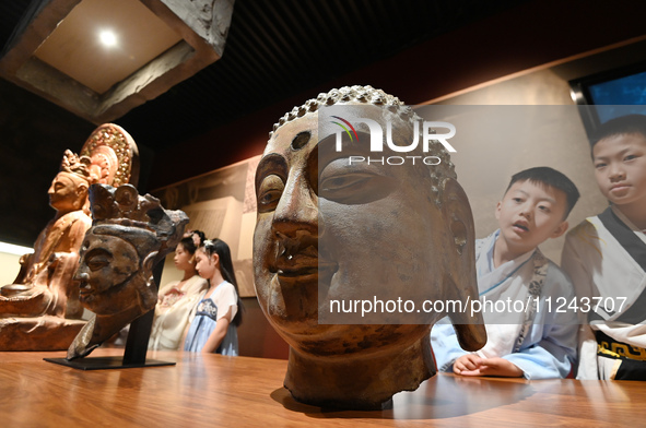 Primary school students are visiting Fengfeng Museum in Handan, China, on May 16, 2024. May 18 is International Museum Day. 