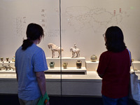 Visitors are looking at a cultural relics exhibition at Qingzhou Museum in East China's Shandong province, on May 16, 2024. (