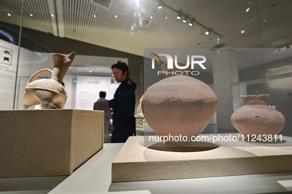 Visitors are looking at a cultural relics exhibition at Qingzhou Museum in East China's Shandong province, on May 16, 2024. 