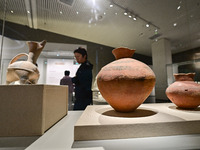 Visitors are looking at a cultural relics exhibition at Qingzhou Museum in East China's Shandong province, on May 16, 2024. (