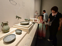 Visitors are looking at a cultural relics exhibition at Qingzhou Museum in East China's Shandong province, on May 16, 2024. (