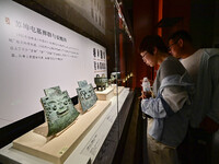 Visitors are looking at a cultural relics exhibition at Qingzhou Museum in East China's Shandong province, on May 16, 2024. (