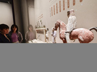 Visitors are looking at a cultural relics exhibition at Qingzhou Museum in East China's Shandong province, on May 16, 2024. (