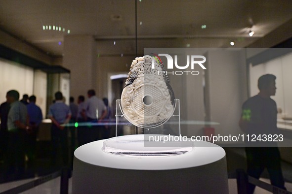 Visitors are looking at a cultural relics exhibition at Qingzhou Museum in East China's Shandong province, on May 16, 2024. 