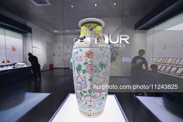 Visitors are looking at a cultural relics exhibition at Qingzhou Museum in East China's Shandong province, on May 16, 2024. 