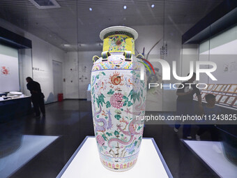 Visitors are looking at a cultural relics exhibition at Qingzhou Museum in East China's Shandong province, on May 16, 2024. (