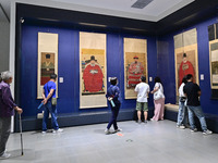 Visitors are looking at a cultural relics exhibition at Qingzhou Museum in East China's Shandong province, on May 16, 2024. (