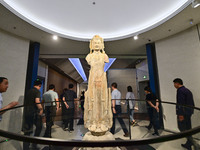 Visitors are looking at a cultural relics exhibition at Qingzhou Museum in East China's Shandong province, on May 16, 2024. (