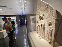 Visitors are looking at a cultural relics exhibition at Qingzhou Museum in East China's Shandong province, on May 16, 2024. (