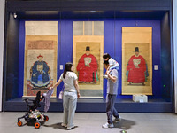 Visitors are looking at a cultural relics exhibition at Qingzhou Museum in East China's Shandong province, on May 16, 2024. (