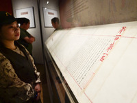 Visitors are looking at a cultural relics exhibition at Qingzhou Museum in East China's Shandong province, on May 16, 2024. (