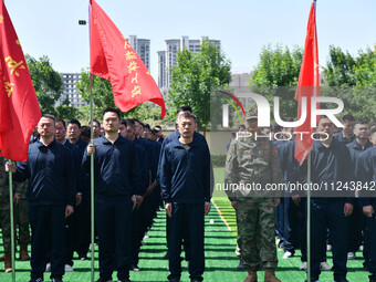 Militiamen are gathering at a checkpoint in Linyi, China, on May 16, 2024. (