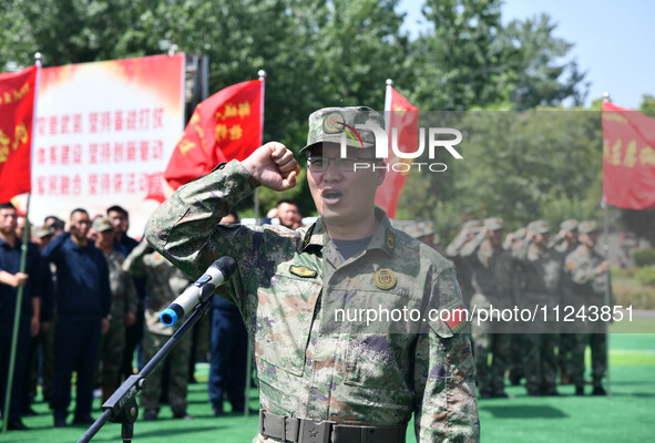 Militia representatives are taking oaths in Linyi, China, on May 16, 2024. 