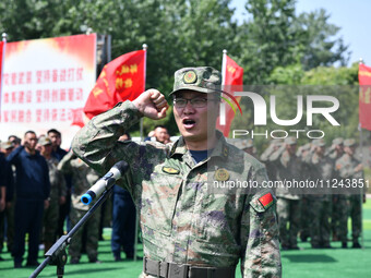 Militia representatives are taking oaths in Linyi, China, on May 16, 2024. (