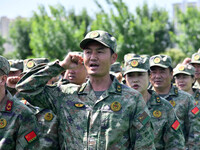 Militia representatives are taking oaths in Linyi, China, on May 16, 2024. (