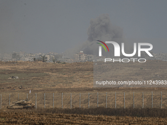 A smoke plume from an explosion is billowing in the Gaza Strip as seen from a position along Israel's southern border with the Palestinian t...