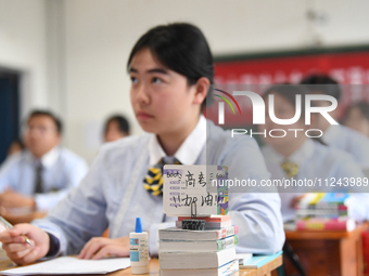 Senior three students are studying hard for the National college entrance examination in a class in Guiyang, China, on May 16, 2024. (