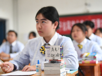 Senior three students are studying hard for the National college entrance examination in a class in Guiyang, China, on May 16, 2024. (