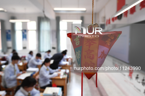 Senior three students are studying hard for the National college entrance examination in a class in Guiyang, China, on May 16, 2024. 