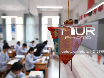 Senior three students are studying hard for the National college entrance examination in a class in Guiyang, China, on May 16, 2024. (