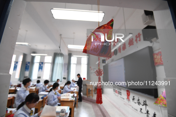 Senior three students are studying hard for the National college entrance examination in a class in Guiyang, China, on May 16, 2024. 