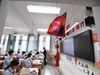 Senior three students are studying hard for the National college entrance examination in a class in Guiyang, China, on May 16, 2024. (