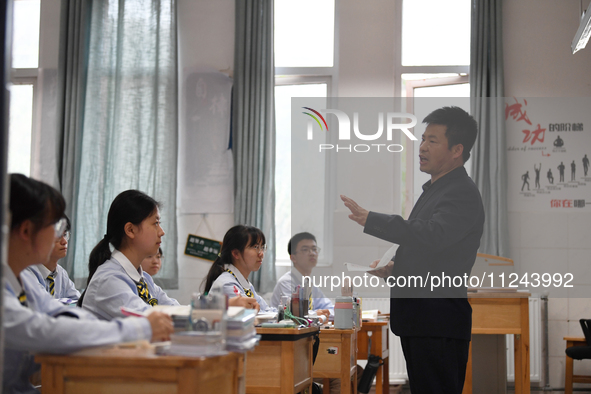 Senior three students are studying hard for the National college entrance examination in a class in Guiyang, China, on May 16, 2024. 