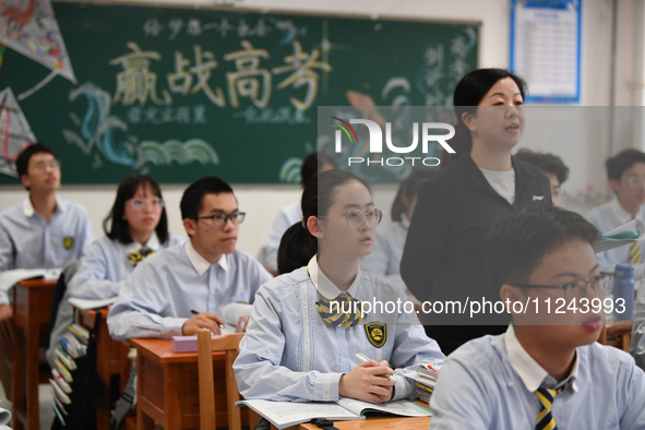 Senior three students are studying hard for the National college entrance examination in a class in Guiyang, China, on May 16, 2024. 