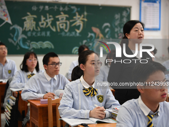 Senior three students are studying hard for the National college entrance examination in a class in Guiyang, China, on May 16, 2024. (