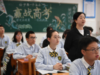 Senior three students are studying hard for the National college entrance examination in a class in Guiyang, China, on May 16, 2024. (