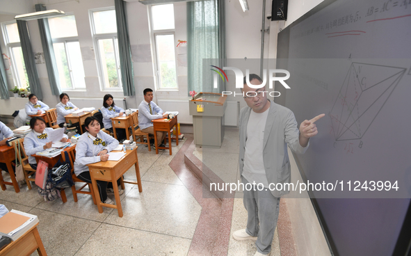 Senior three students are studying hard for the National college entrance examination in a class in Guiyang, China, on May 16, 2024. 