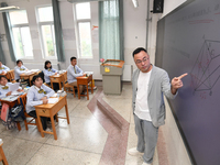 Senior three students are studying hard for the National college entrance examination in a class in Guiyang, China, on May 16, 2024. (