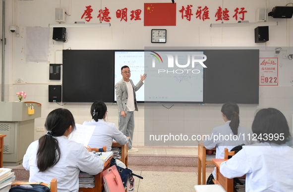 Senior three students are studying hard for the National college entrance examination in a class in Guiyang, China, on May 16, 2024. 