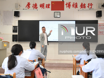 Senior three students are studying hard for the National college entrance examination in a class in Guiyang, China, on May 16, 2024. (