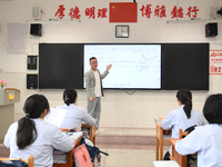 Senior three students are studying hard for the National college entrance examination in a class in Guiyang, China, on May 16, 2024. (