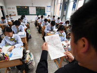 Senior three students are studying hard for the National college entrance examination in a class in Guiyang, China, on May 16, 2024. (