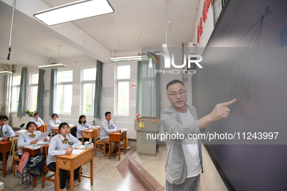 Senior three students are studying hard for the National college entrance examination in a class in Guiyang, China, on May 16, 2024. 