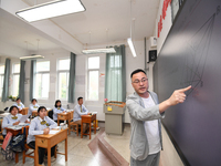 Senior three students are studying hard for the National college entrance examination in a class in Guiyang, China, on May 16, 2024. (