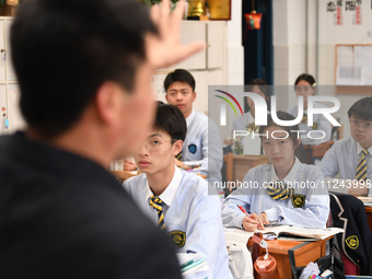 Senior three students are studying hard for the National college entrance examination in a class in Guiyang, China, on May 16, 2024. (