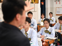 Senior three students are studying hard for the National college entrance examination in a class in Guiyang, China, on May 16, 2024. (