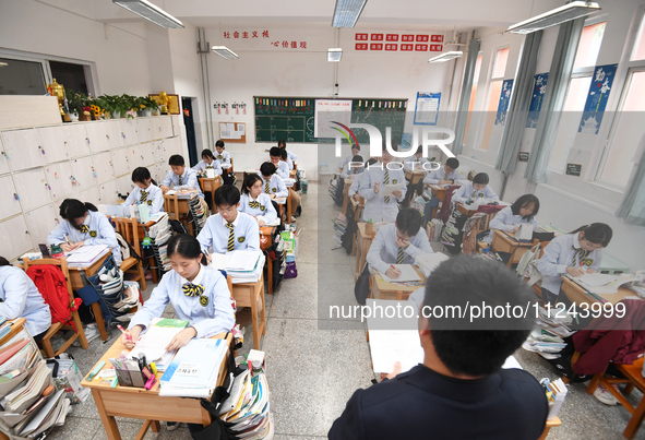 Senior three students are studying hard for the National college entrance examination in a class in Guiyang, China, on May 16, 2024. 