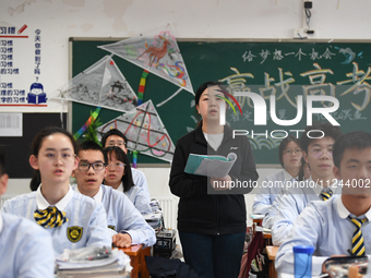 Senior three students are studying hard for the National college entrance examination in a class in Guiyang, China, on May 16, 2024. (