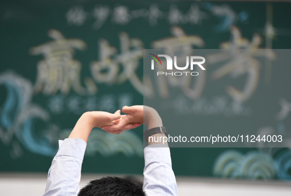 Senior three students are studying hard for the National college entrance examination in a class in Guiyang, China, on May 16, 2024. 