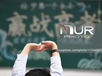 Senior three students are studying hard for the National college entrance examination in a class in Guiyang, China, on May 16, 2024. (