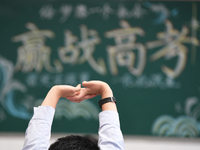 Senior three students are studying hard for the National college entrance examination in a class in Guiyang, China, on May 16, 2024. (