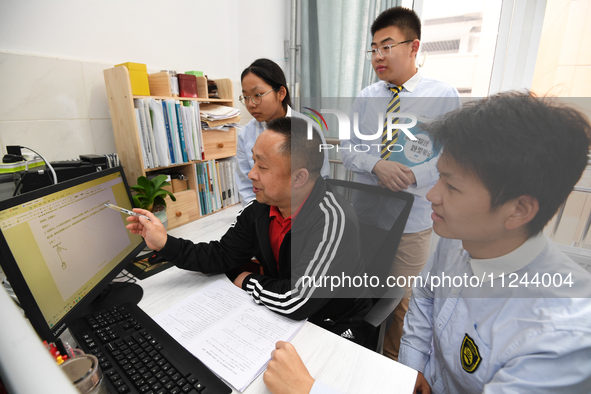 Senior three students are studying hard for the National college entrance examination in a class in Guiyang, China, on May 16, 2024. 