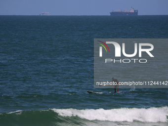 This picture is showing a view of a cargo freight ship in the Mediterranean Sea off the coast of the Gaza Strip, on May 16, 2024. (