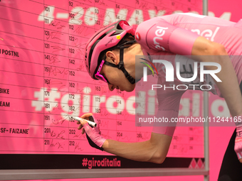 Tadej Pogacar of Slovenia and UAE Team Emirates - Pink Leader Jersey signing prior to the 107th Giro d'Italia 2024, Stage 12, a 193km stage...