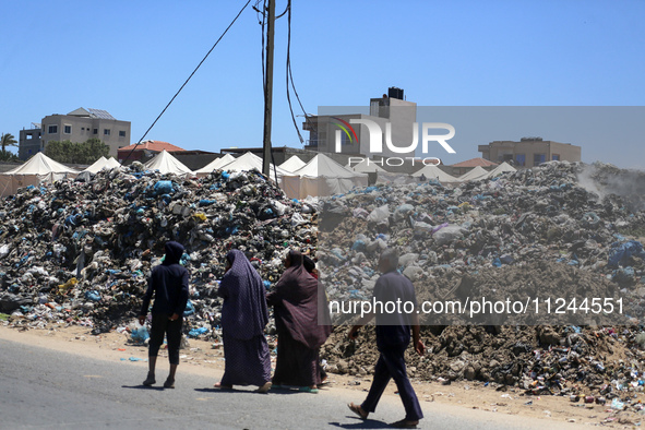 A view is showing piles of garbage amid the ongoing conflict in Gaza between Israel and Hamas, in Deir Al-Balah, in the central Gaza Strip,...