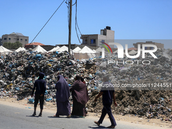 A view is showing piles of garbage amid the ongoing conflict in Gaza between Israel and Hamas, in Deir Al-Balah, in the central Gaza Strip,...